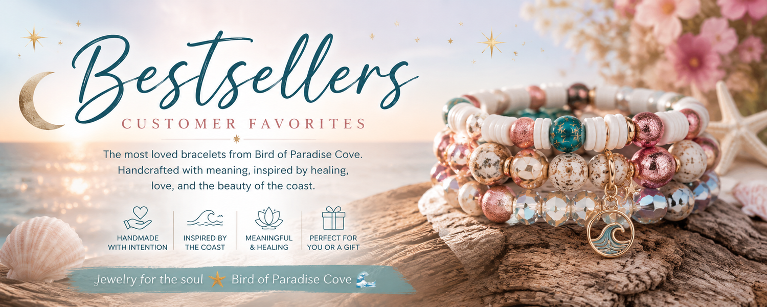 Bestsellers collection banner for Bird of Paradise Cove featuring stacked coastal and celestial bracelets on driftwood with soft ocean sunset background, pastel florals, seashell accents, and text highlighting handmade meaningful jewelry favorites.
