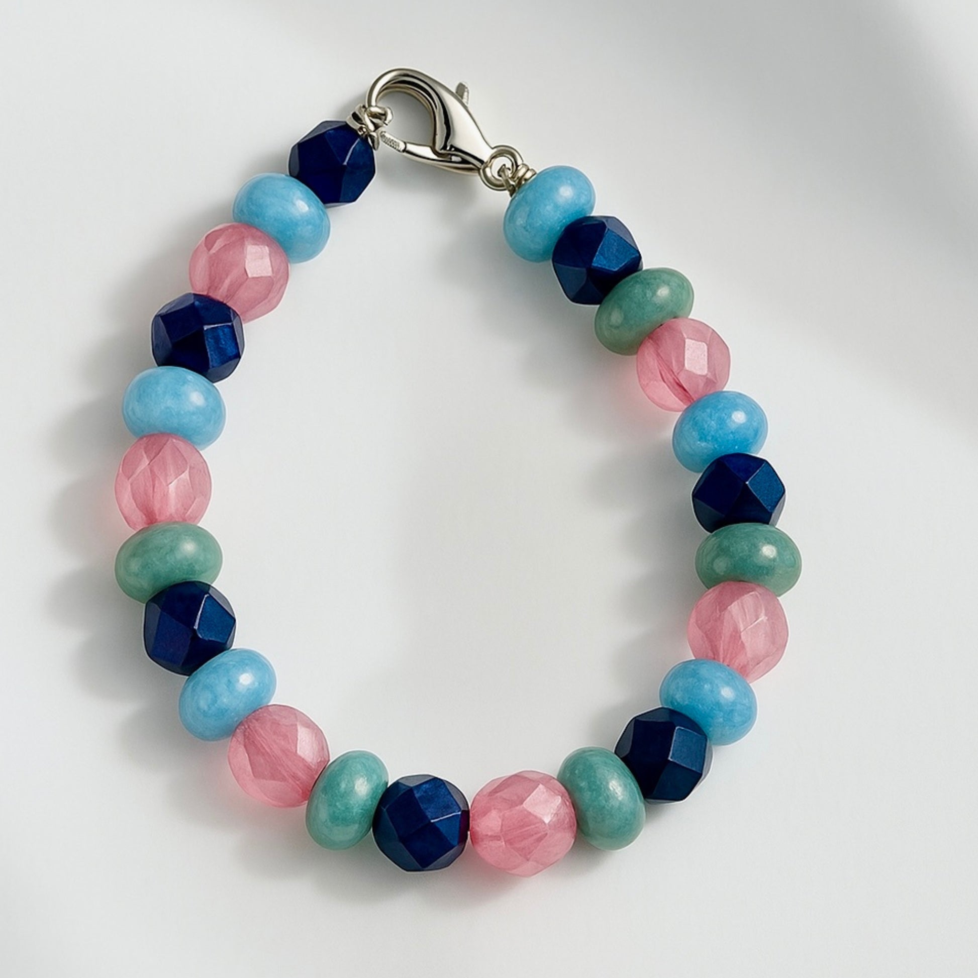 Handmade beaded bracelet displayed in a circular shape on a clean background, showing size and bead arrangement