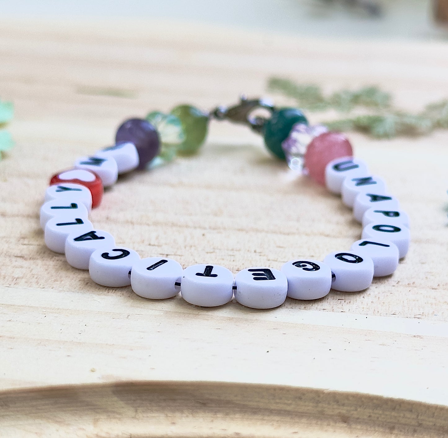 Beaded affirmation bracelet displayed in a cozy, natural setting emphasizing self-love and authenticity.