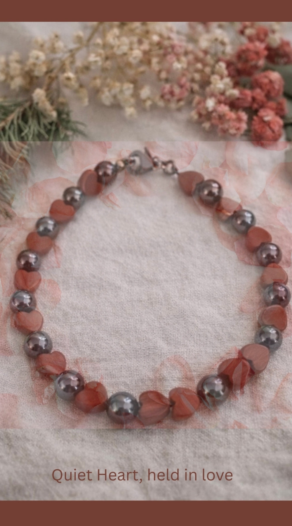 Quiet Heart bracelet styled with dried flowers and soft greenery, symbolizing calm, love, and grounding