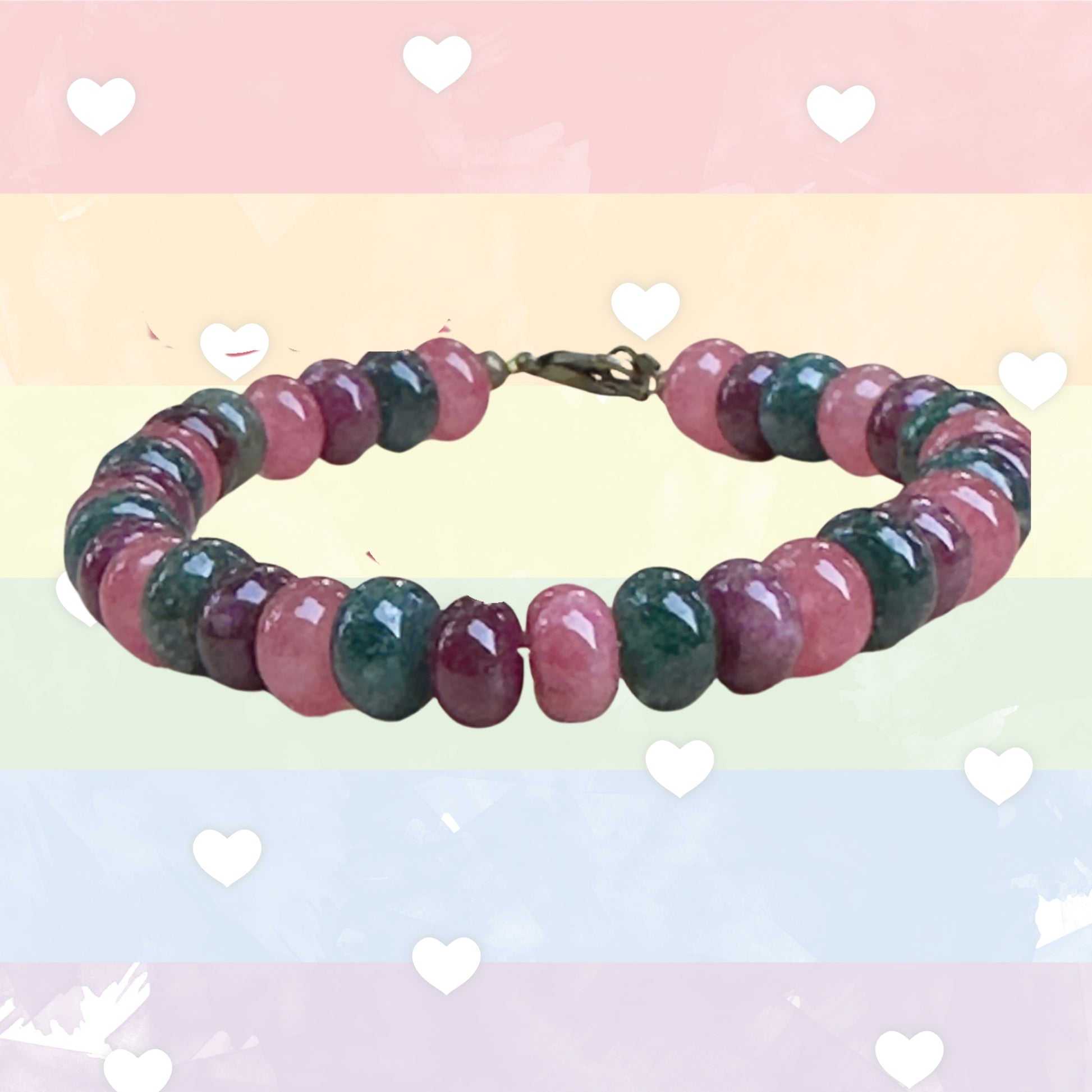 Multicolored beaded bracelet on a pastel background with heart shapes