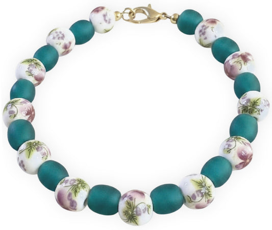Bracelet with floral-patterned beads on a white background