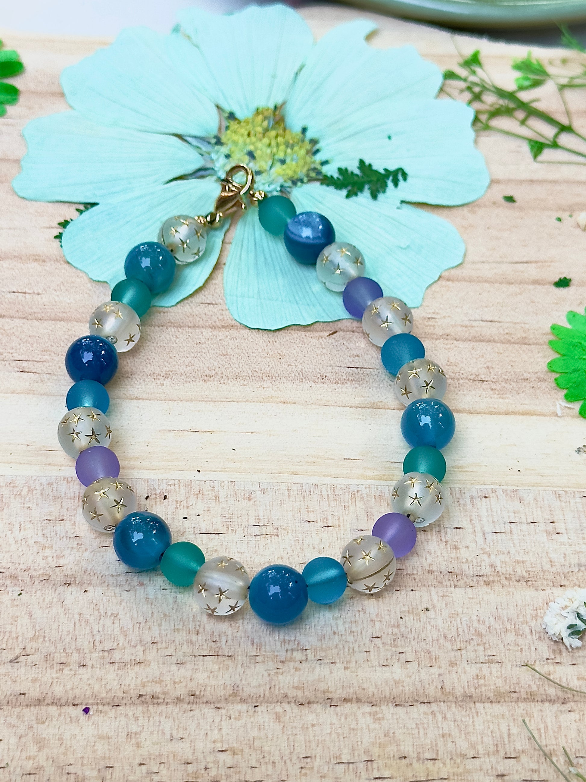 Handmade Celestial Opalite Sky bracelet shown in a full circular flat lay highlighting blue and opalite beads