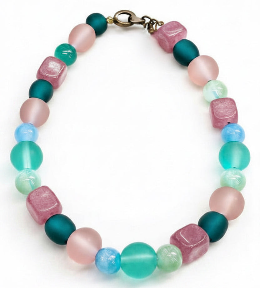 spring gemstone bracelet with pink jade teal and aqua beads on white background handmade beaded jewelry