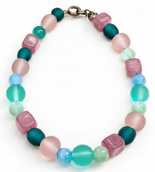spring gemstone bracelet with pink jade teal and aqua beads on white background handmade beaded jewelry