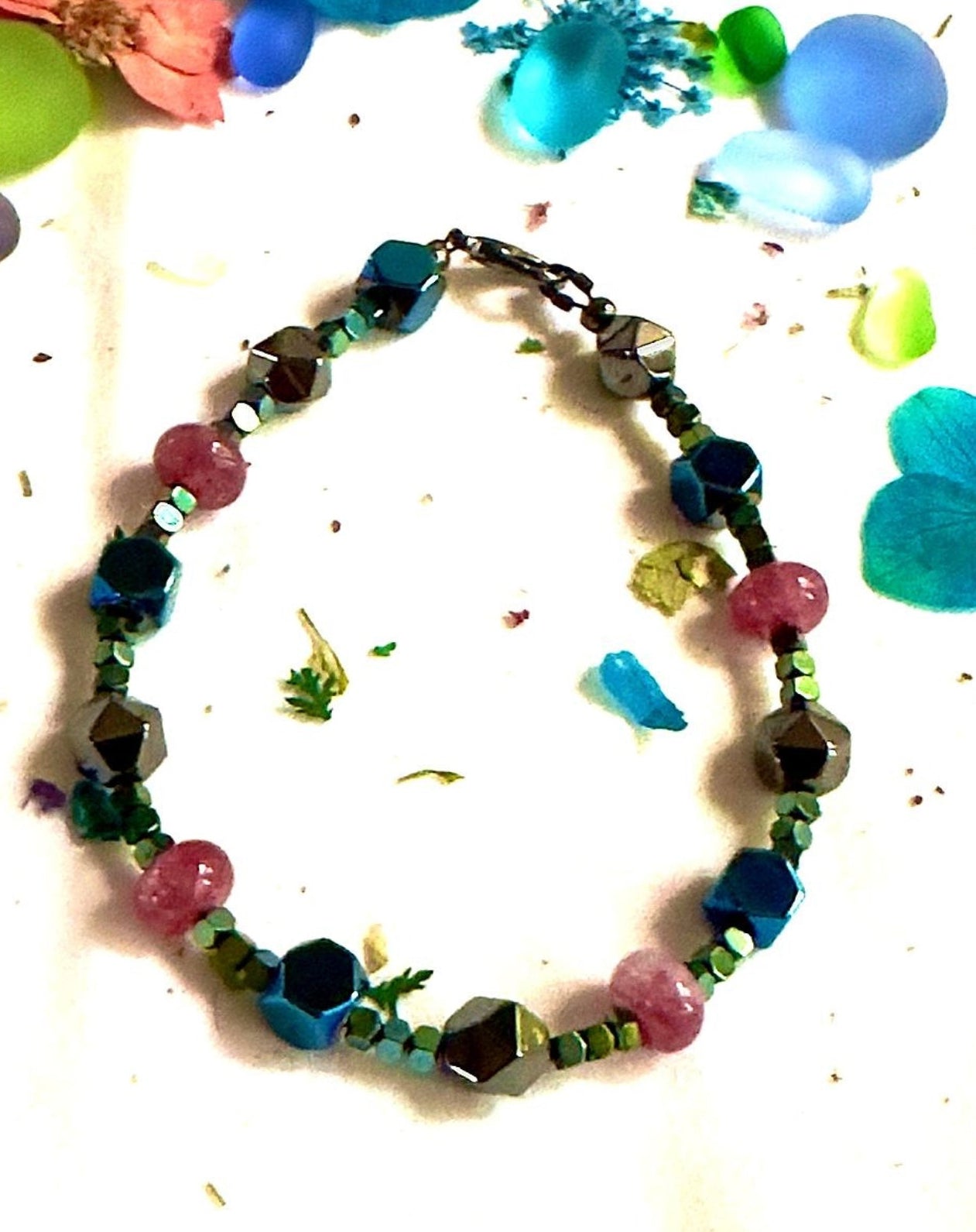 Artistic beaded bracelet with cosmic lagoon color palette and metallic shimmer
