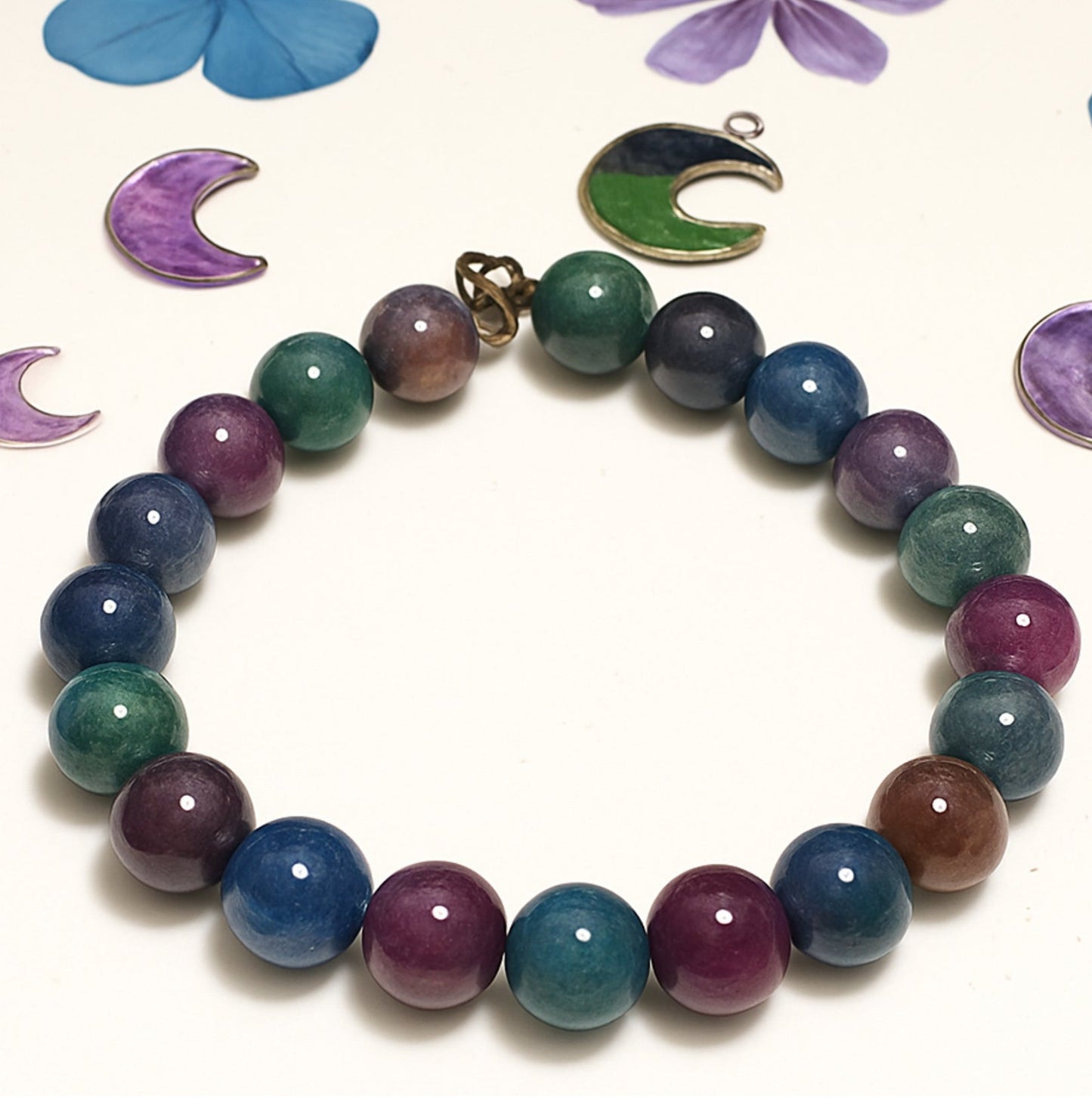 Dreamy celestial gemstone bracelet styled with moon charms and floral accents