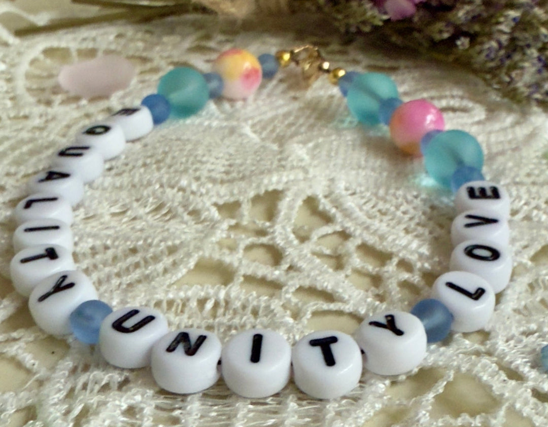 close up of Unity letter beads with pastel blue gemstone beads handmade bracelet detail sho