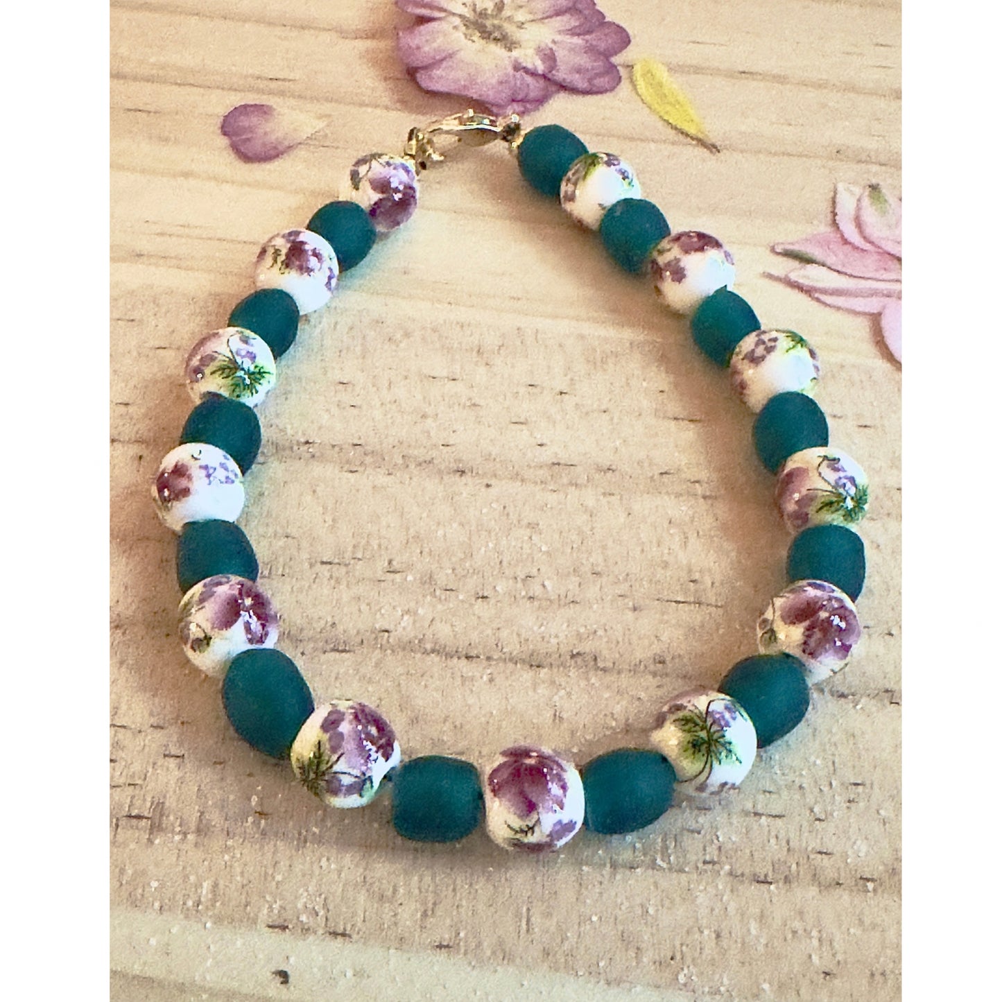 Lightweight handmade bracelet with green beads and floral accents for calming style