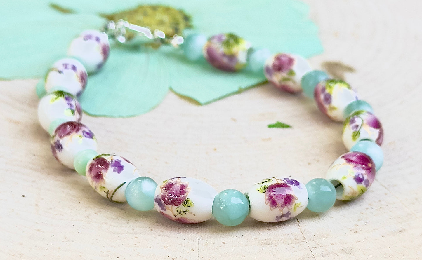 Full view of Hidden Reverie Meadow bracelet featuring porcelain floral beads inspired by wildflower meadows.