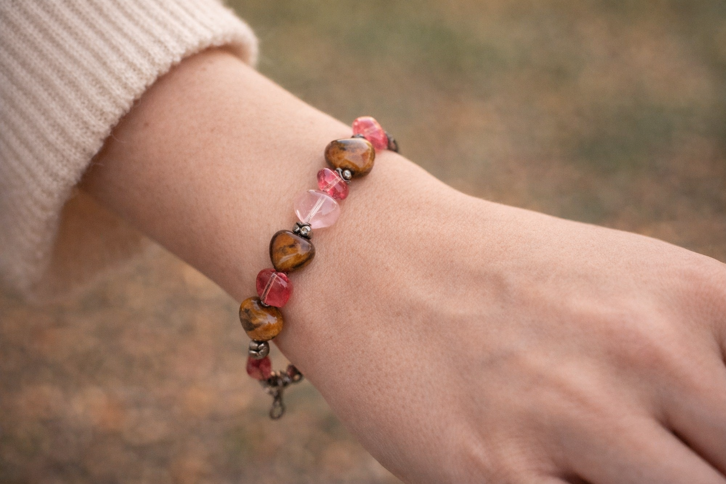 Rooted in Harmony Anchored in Love bracelet worn on wrist showing natural fit and heart gemstone details