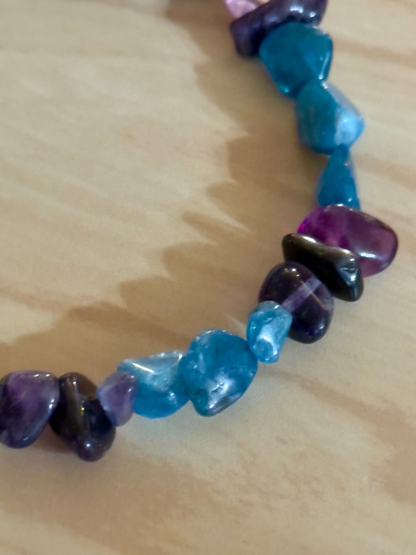 Close up detail of Amethyst and Amazonite gemstone beads for emotional balance jewelry