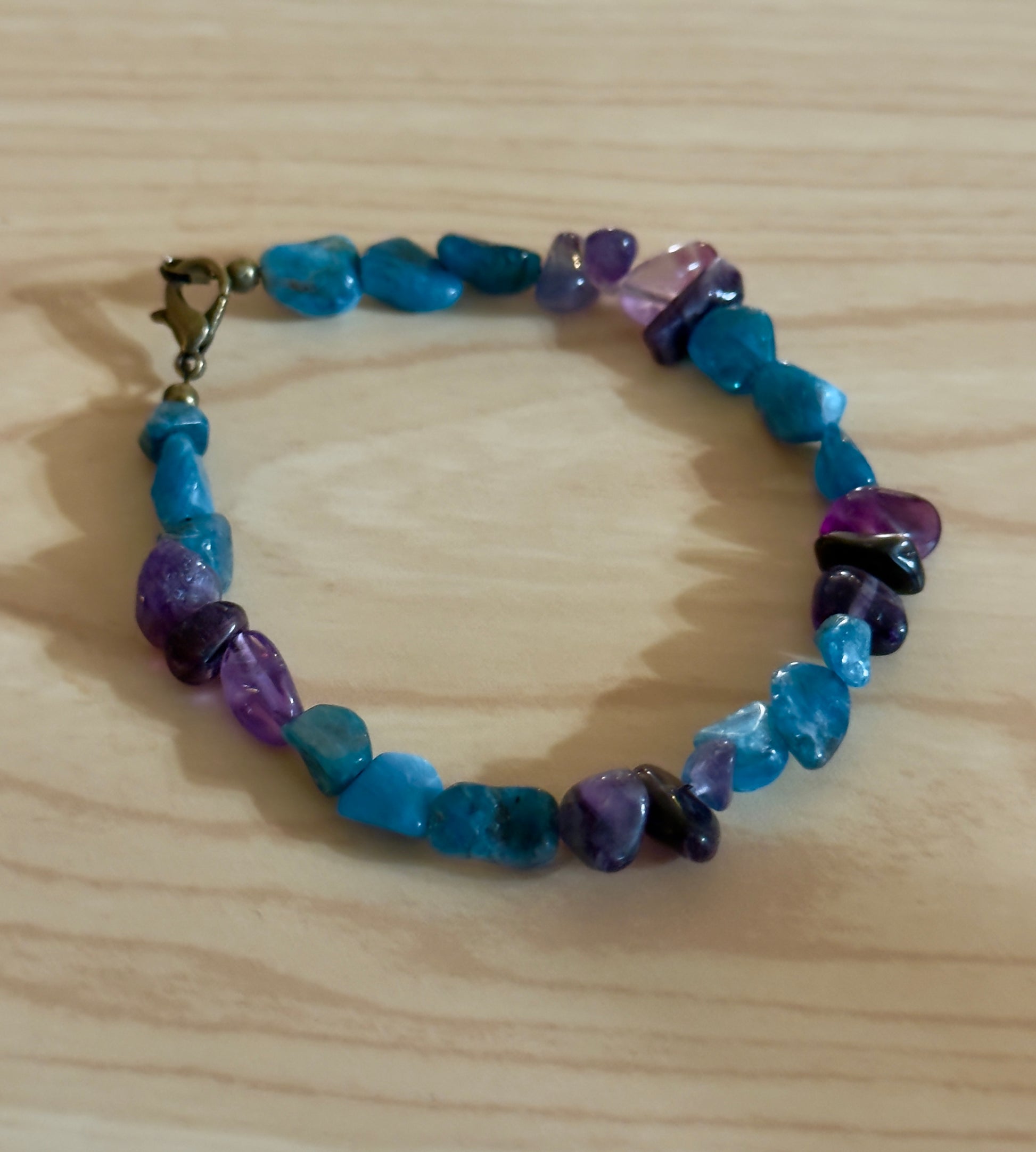 Handmade mental wellness bracelet featuring Amazonite blue stones and Amethyst chips