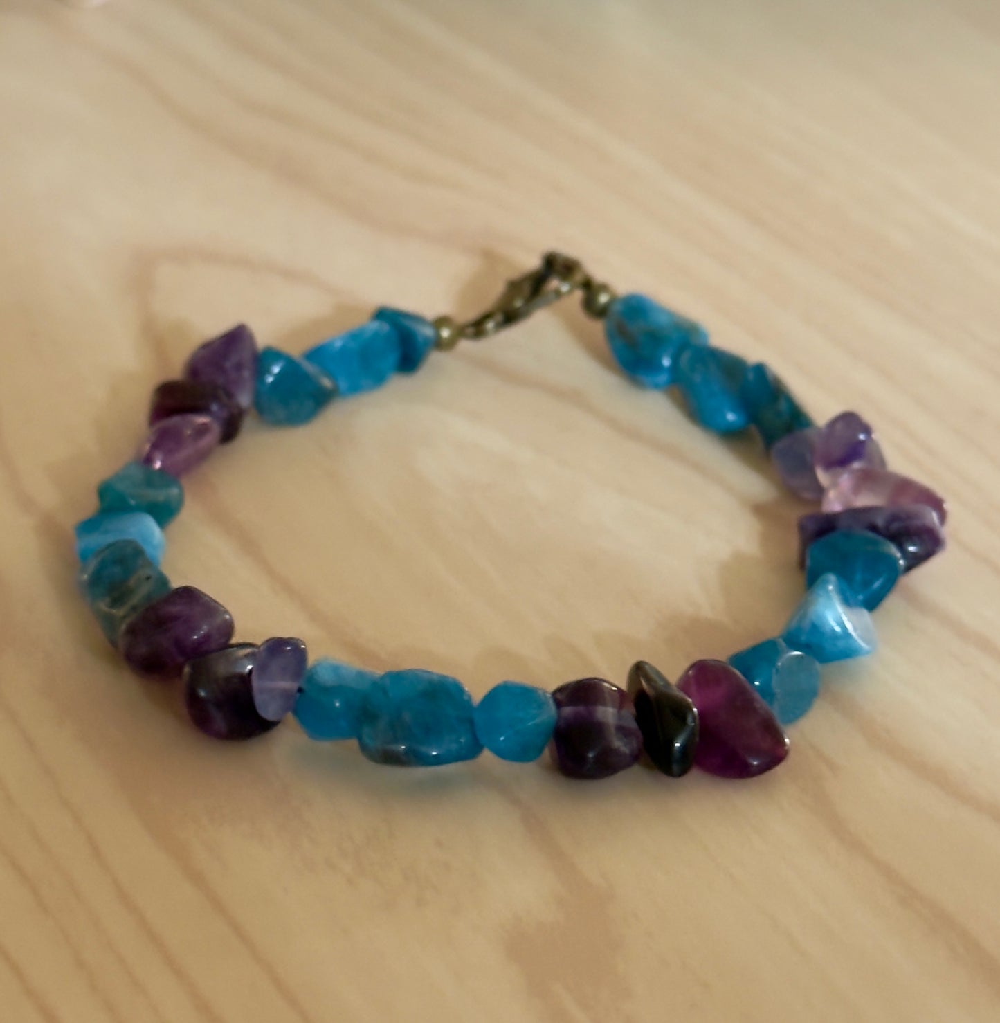 Handcrafted blue and purple gemstone bracelet for mental health awareness