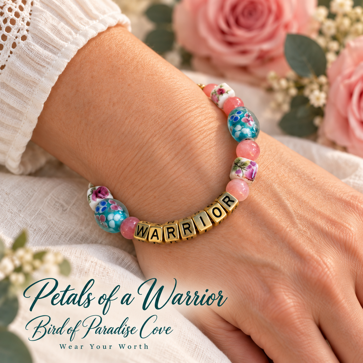 Close-up of a wrist wearing a Breast Cancer Awareness Bracelet with colorful beads and the word 'WARRIOR' prominently displayed.