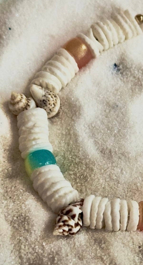 Close up of heishi beads and natural shell details