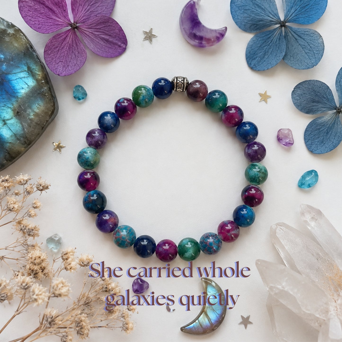 Celestial gemstone bracelet with inspirational quote about carrying whole galaxies quietly