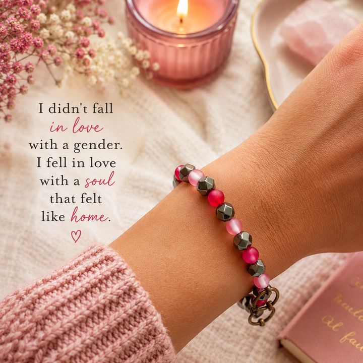 Woman wearing the Soul Connection bracelet with pink, raspberry, and hematite beads, symbolizing love, authenticity, and meaningful connection.