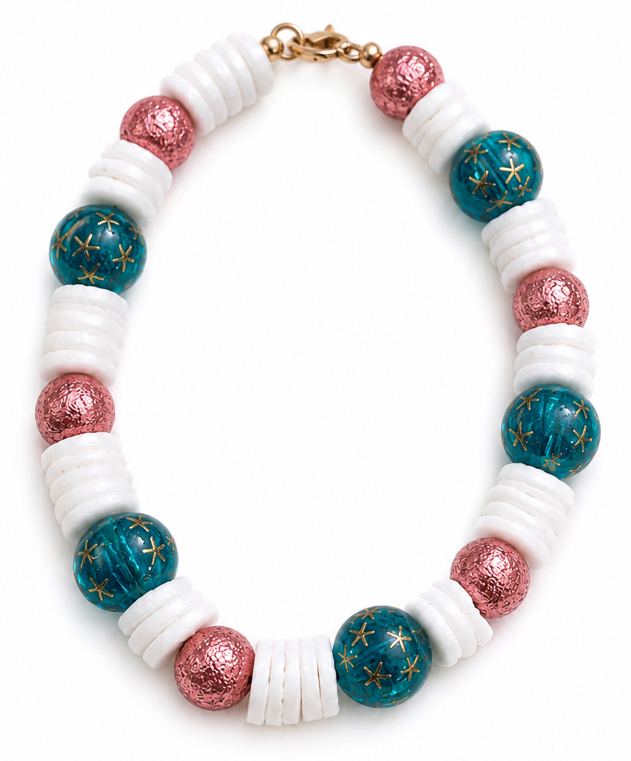 Starfall Shores celestial bracelet with teal galaxy beads, pink shimmer accents, and white shell spacer beads on white background