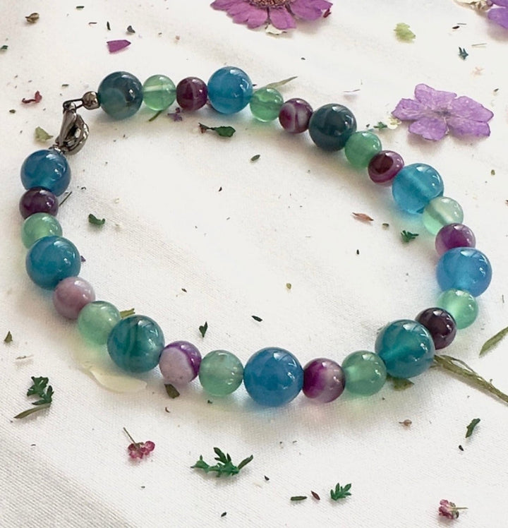     Flat lay view of the Summertide Dreams ocean-inspired bracelet on a light background.