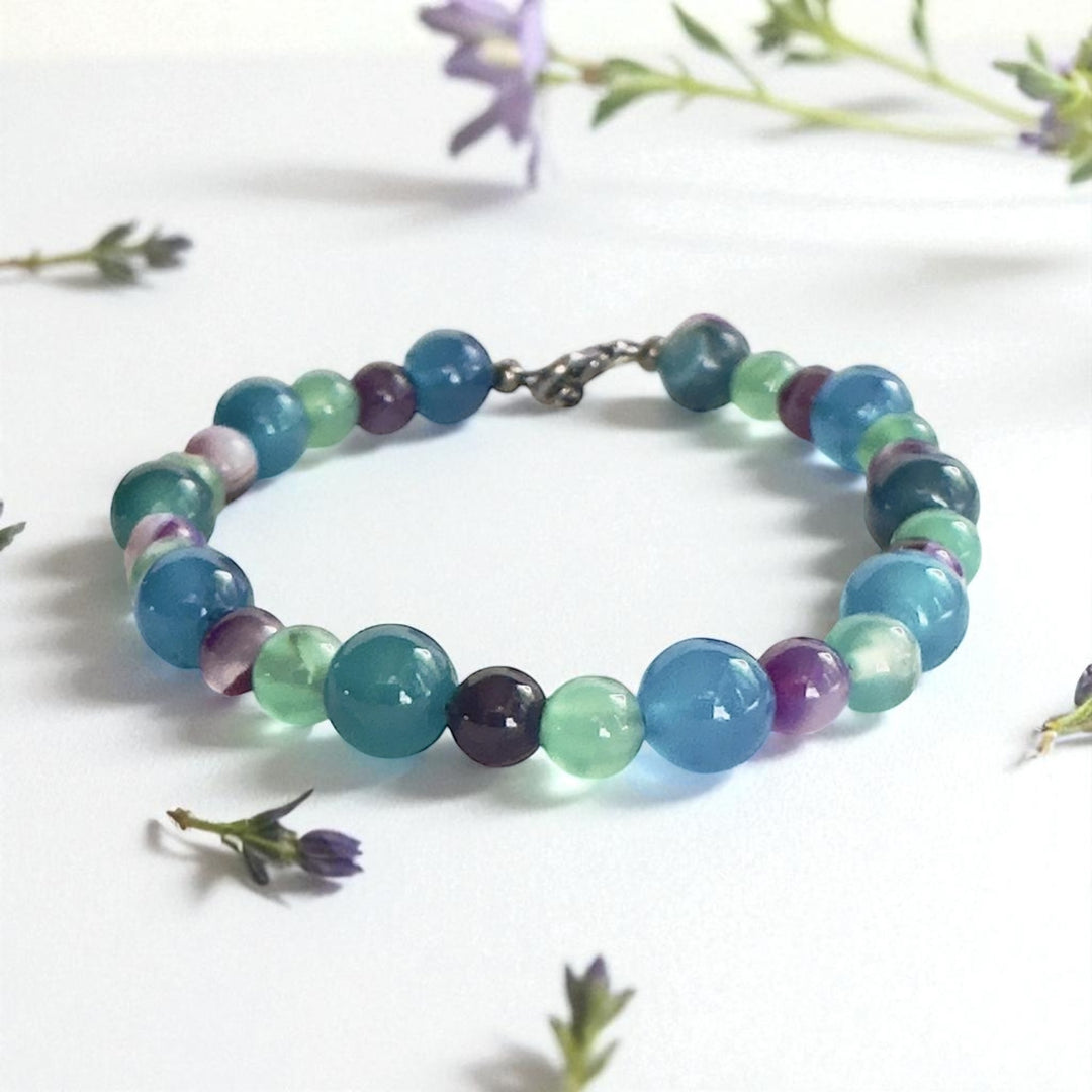  Summertide Dreams handmade ocean-inspired bracelet styled with delicate flowers.