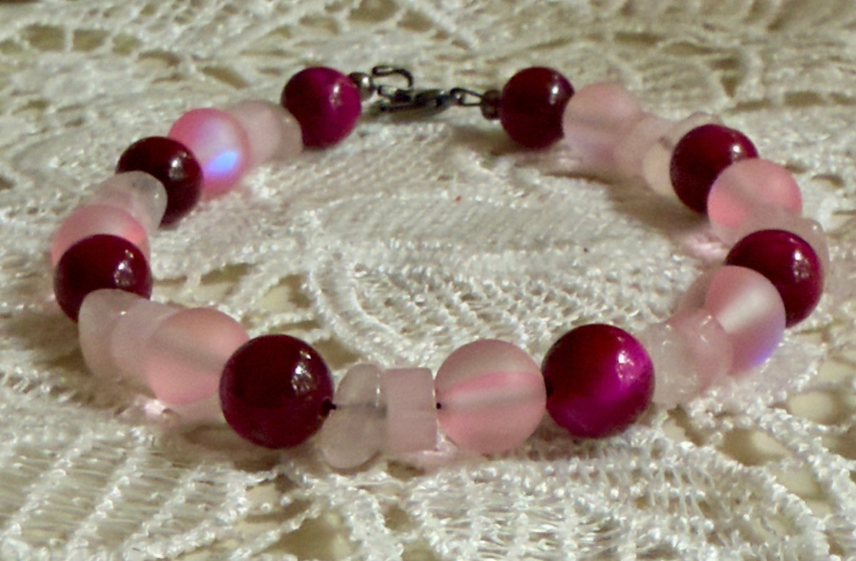 new bracelet featuring magenta Tiger’s Eye and Rose Quartz for breast cancer awareness support.