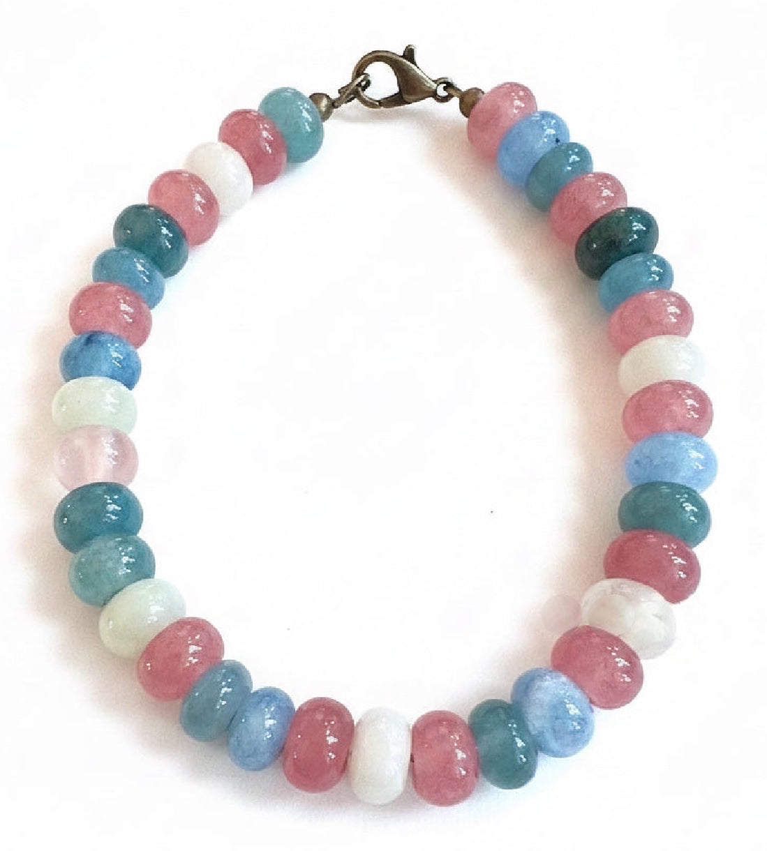 Transcendently You True Colors Pride Bracelet featuring pink, blue, and white beads inspired by the Trans Pride flag on a white background.