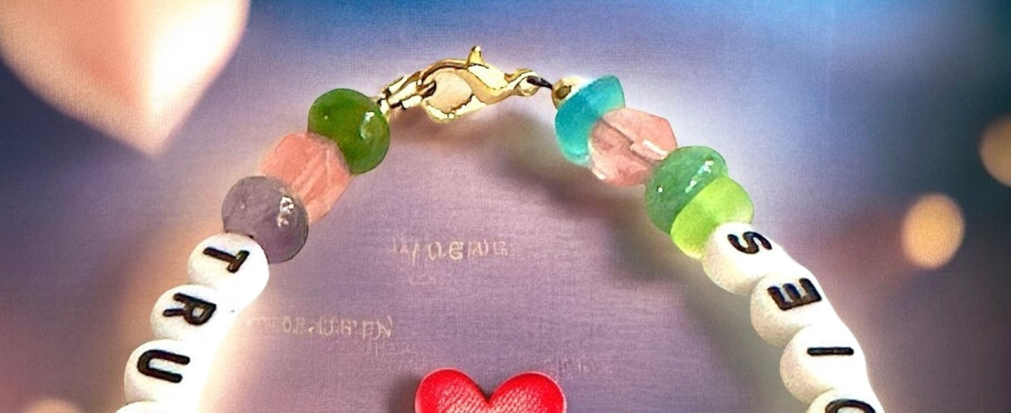 True Love Never Dies bracelet surrounding a glowing red heart on a dreamy background with soft heart-shaped lights.