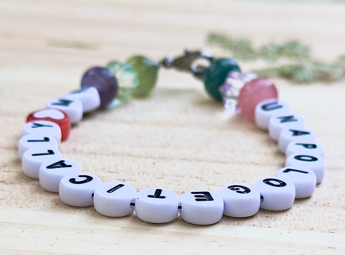 Handmade Unapologetically Me beaded bracelet close up pastel gemstone detail