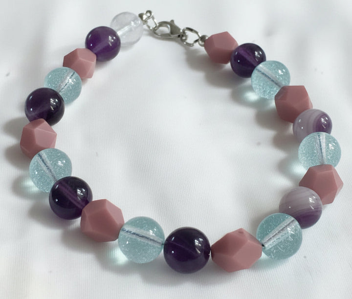 Velvet Moon Glow bracelet flat lay with dreamy pastel gemstone beads and soft coastal styling