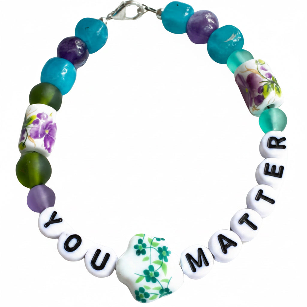 Bracelet with colorful beads and 'YOU MATTER' message on a white background